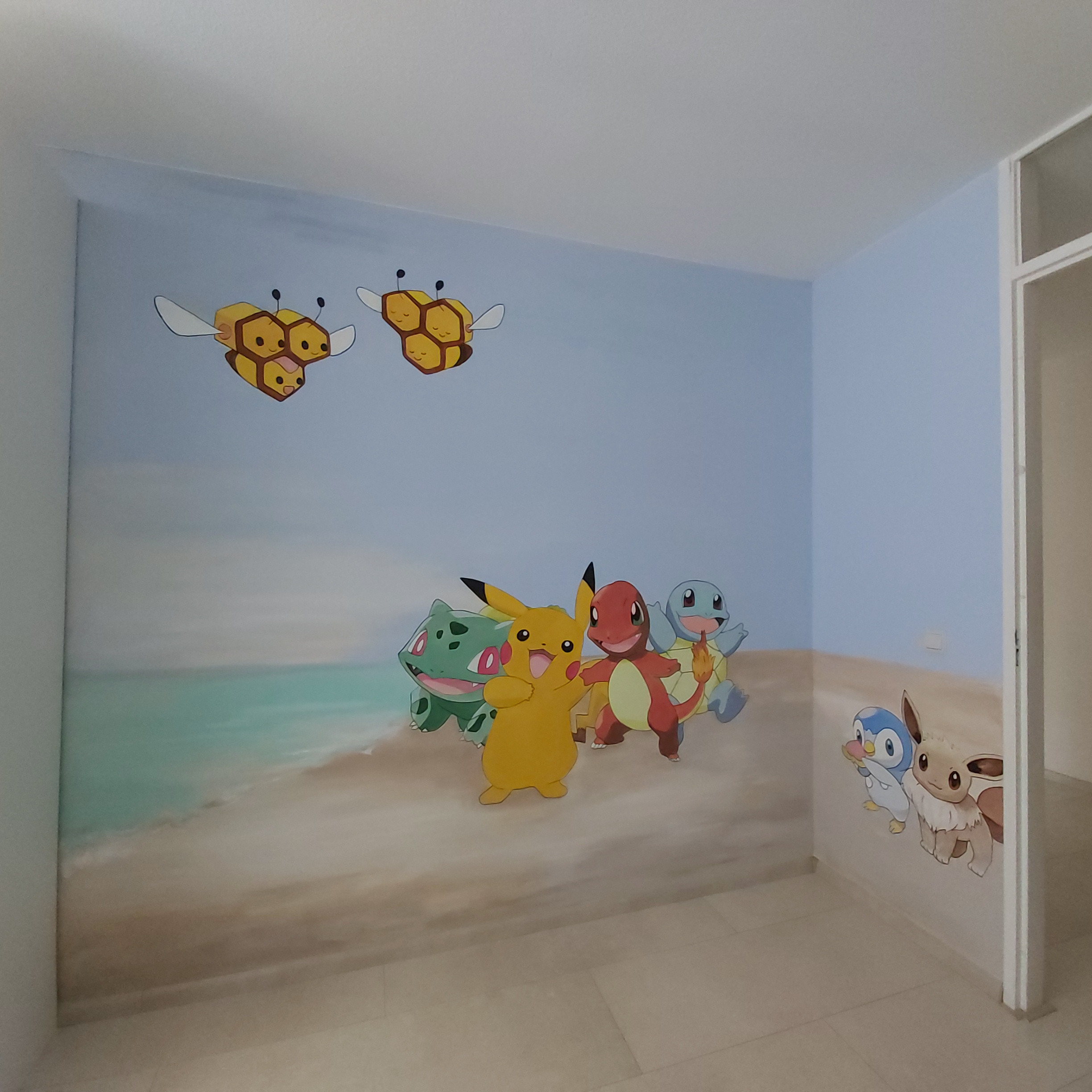 Muurschildering pokemon op het strand